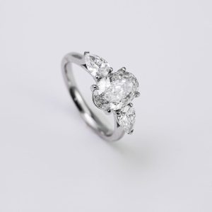 Oval Brilliant & Pear Three-Stone Diamond Ring